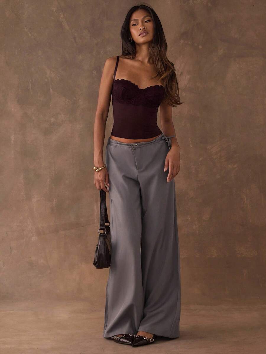 Women's black contrast lace camisole with spaghetti straps, cup detail, semi-sheer finish, and slim fit for going out or date night.