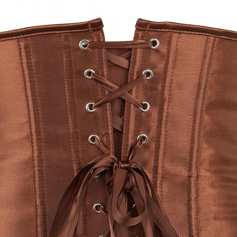 Vintage lace-up waist trainer corset with grommet eyelet details and plant pattern, designed for Halloween styling.