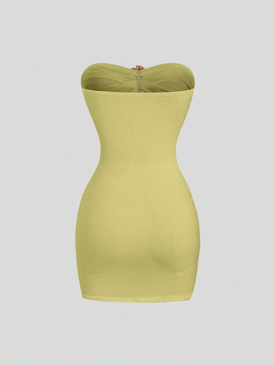 Women's black strapless bodycon mini dress featuring ruched detailing, cut-out design with ring accent, mid-waist pencil hem, and slim fit knitted stretch fabric.