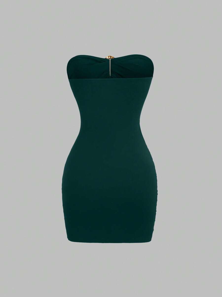 Women's black strapless bodycon mini dress featuring ruched detailing, cut-out design with ring accent, mid-waist pencil hem, and slim fit knitted stretch fabric.