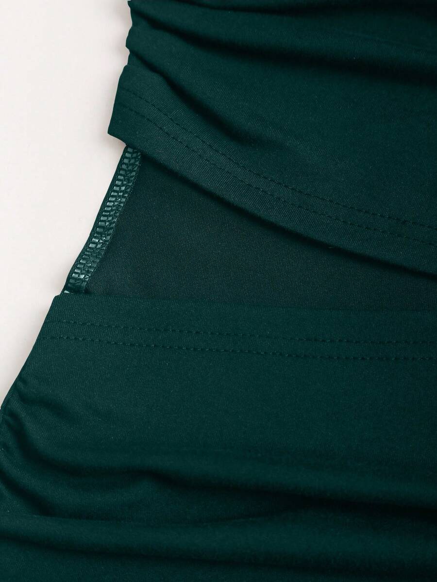 Women's black strapless bodycon mini dress featuring ruched detailing, cut-out design with ring accent, mid-waist pencil hem, and slim fit knitted stretch fabric.