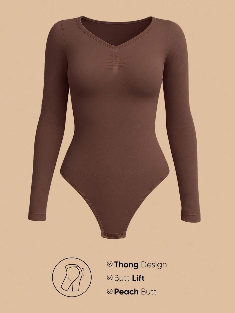 Women's long sleeve shapewear bodysuit featuring tummy control and waist training support