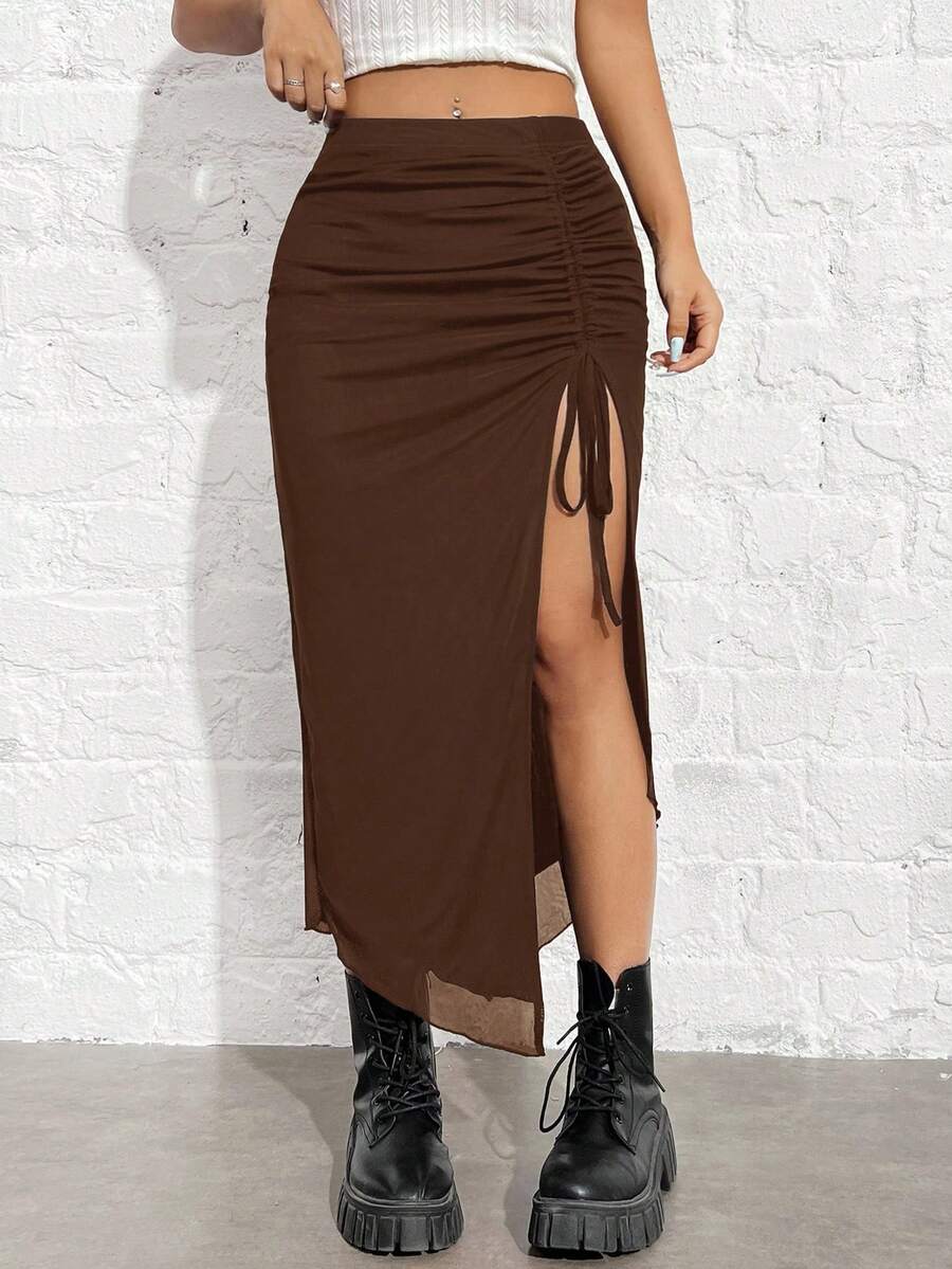 Women's black high-waisted bodycon long skirt featuring a drawstring split thigh detail and mesh fabric.