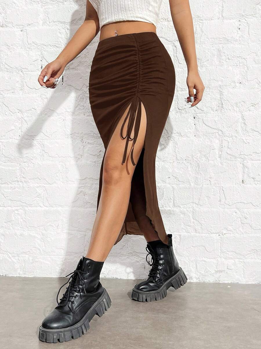 Women's black high-waisted bodycon long skirt featuring a drawstring split thigh detail and mesh fabric.