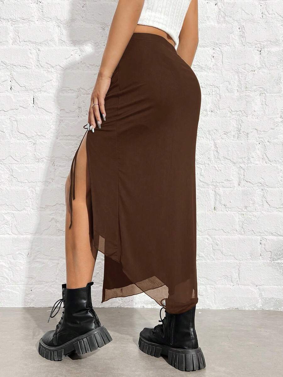 Women's black high-waisted bodycon long skirt featuring a drawstring split thigh detail and mesh fabric.