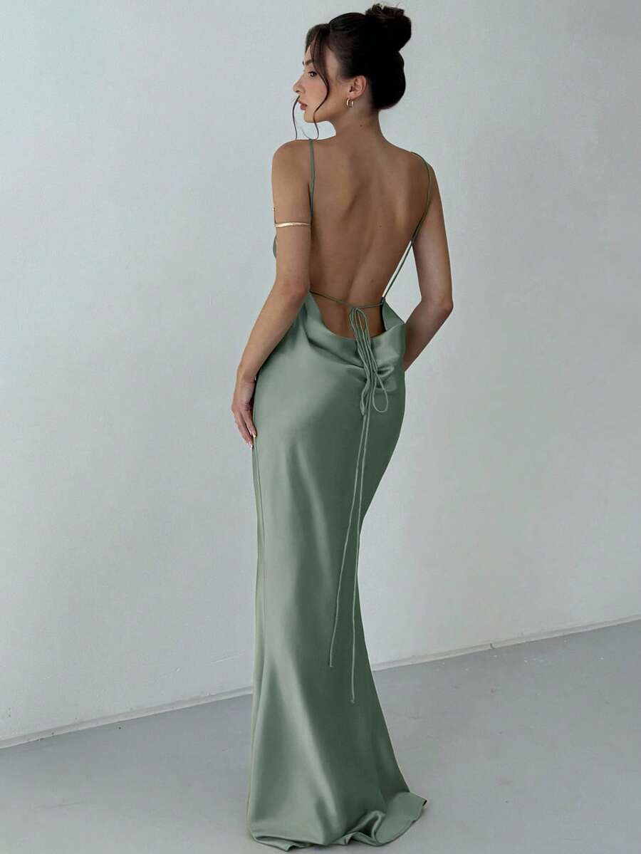 Beige satin backless maxi dress featuring criss-cross spaghetti straps and a mermaid hemline.