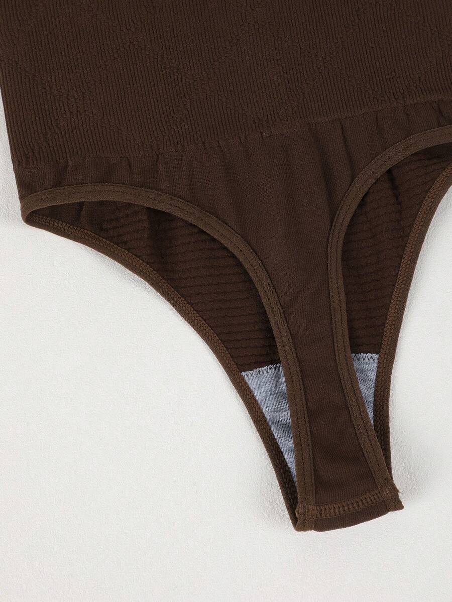 Black high waist seamless tummy control panties for women featuring high-stretch knitted fabric and contrast mesh details.