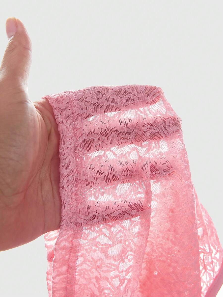 Women's hot pink contrast lace graphic embroidered camisole top featuring spaghetti straps, slim fit micro crop length, and semi-sheer unlined knitted fabric.
