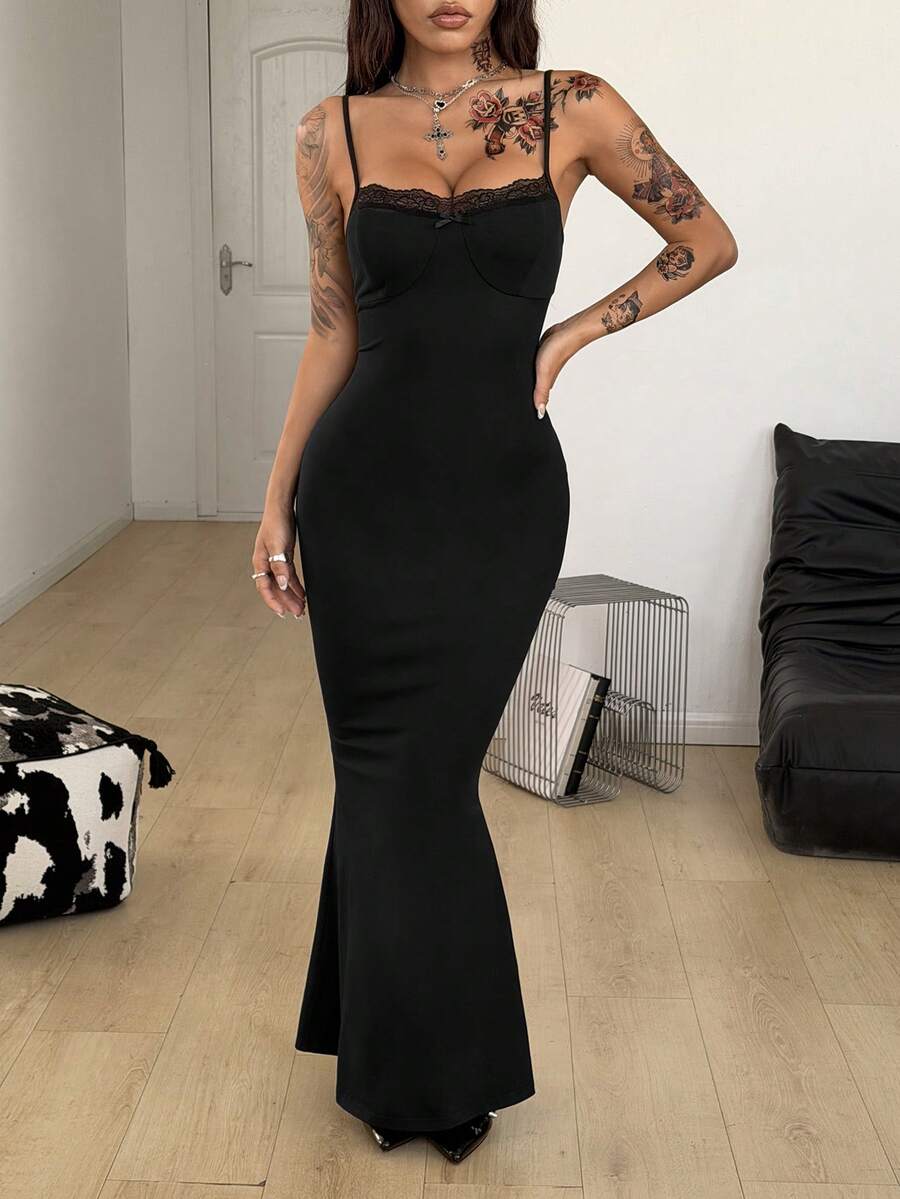 Black backless cami midi dress for women featuring spaghetti straps, slim fit mermaid silhouette, backless button detail, and high stretch knitted fabric.