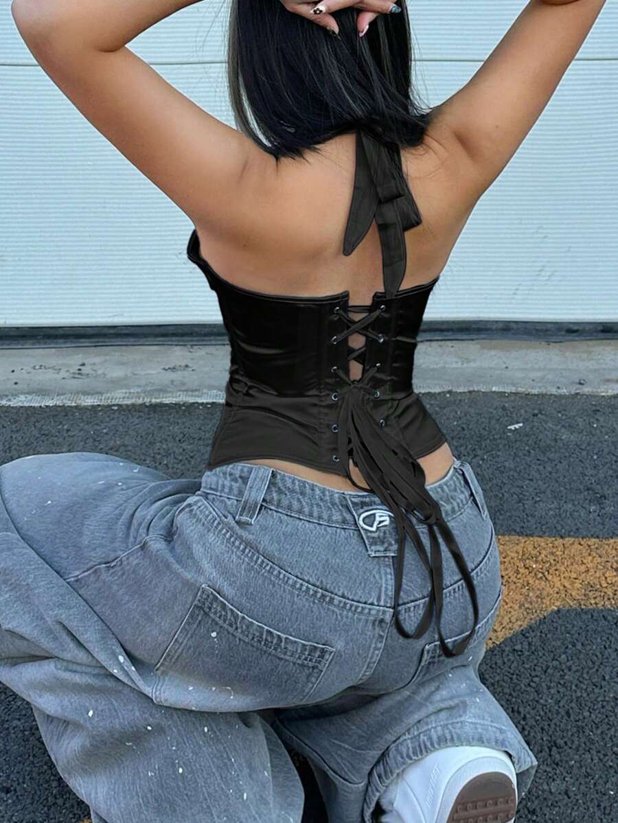 White satin corset crop top featuring a halter neck, slim fit, and back lace-up design.