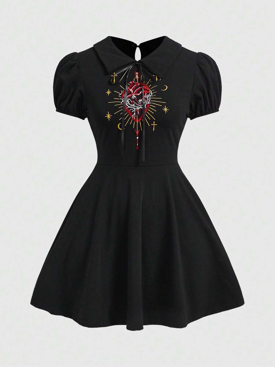 Black gothic mini dress for women with red heart embroidery pattern, short puff sleeves, collar neckline, and a fit and flare high-waist silhouette.