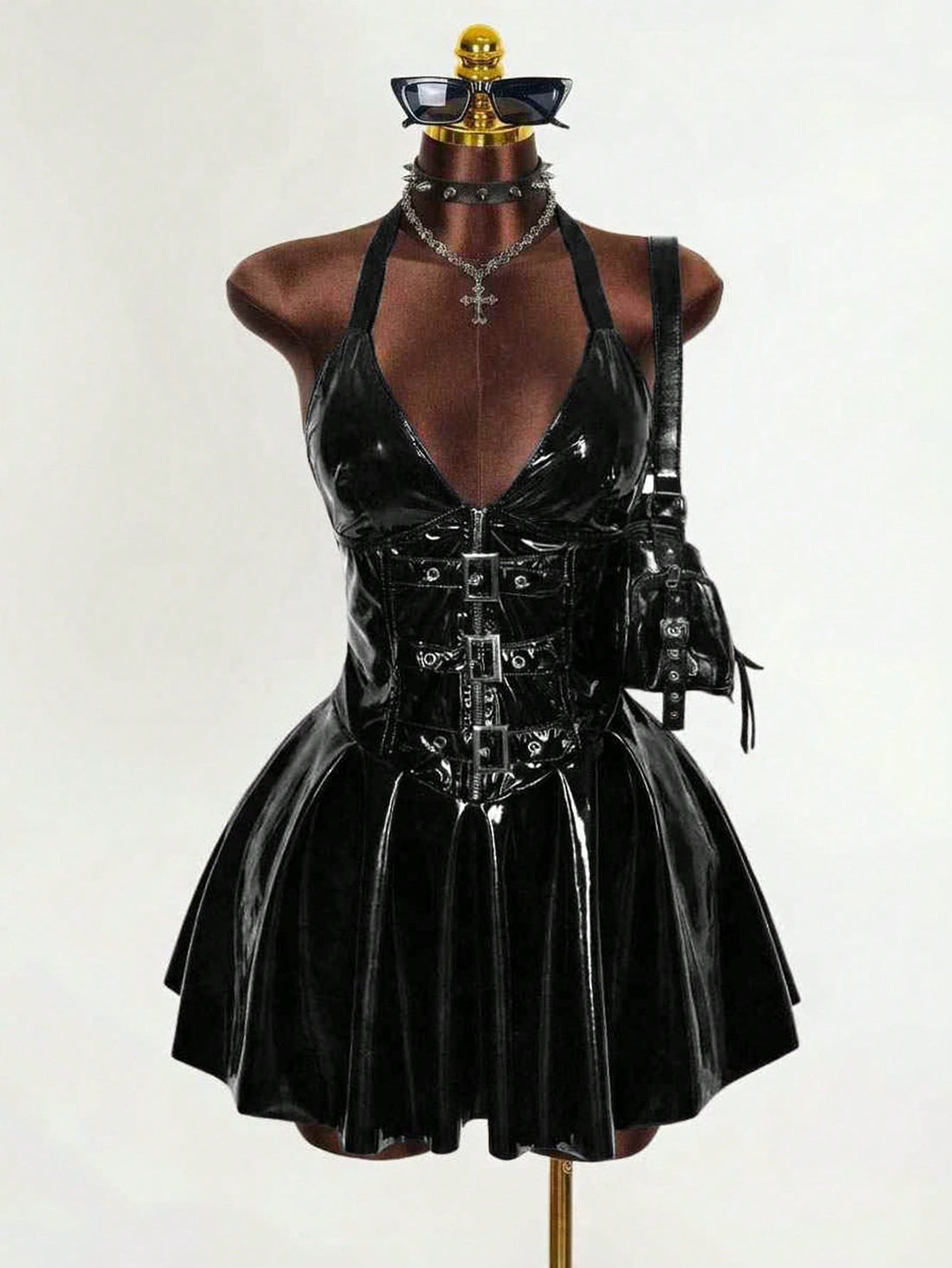 Women's black Goth PU leather mini dress featuring a backless halter neckline, cold shoulder detail, and flared hem.