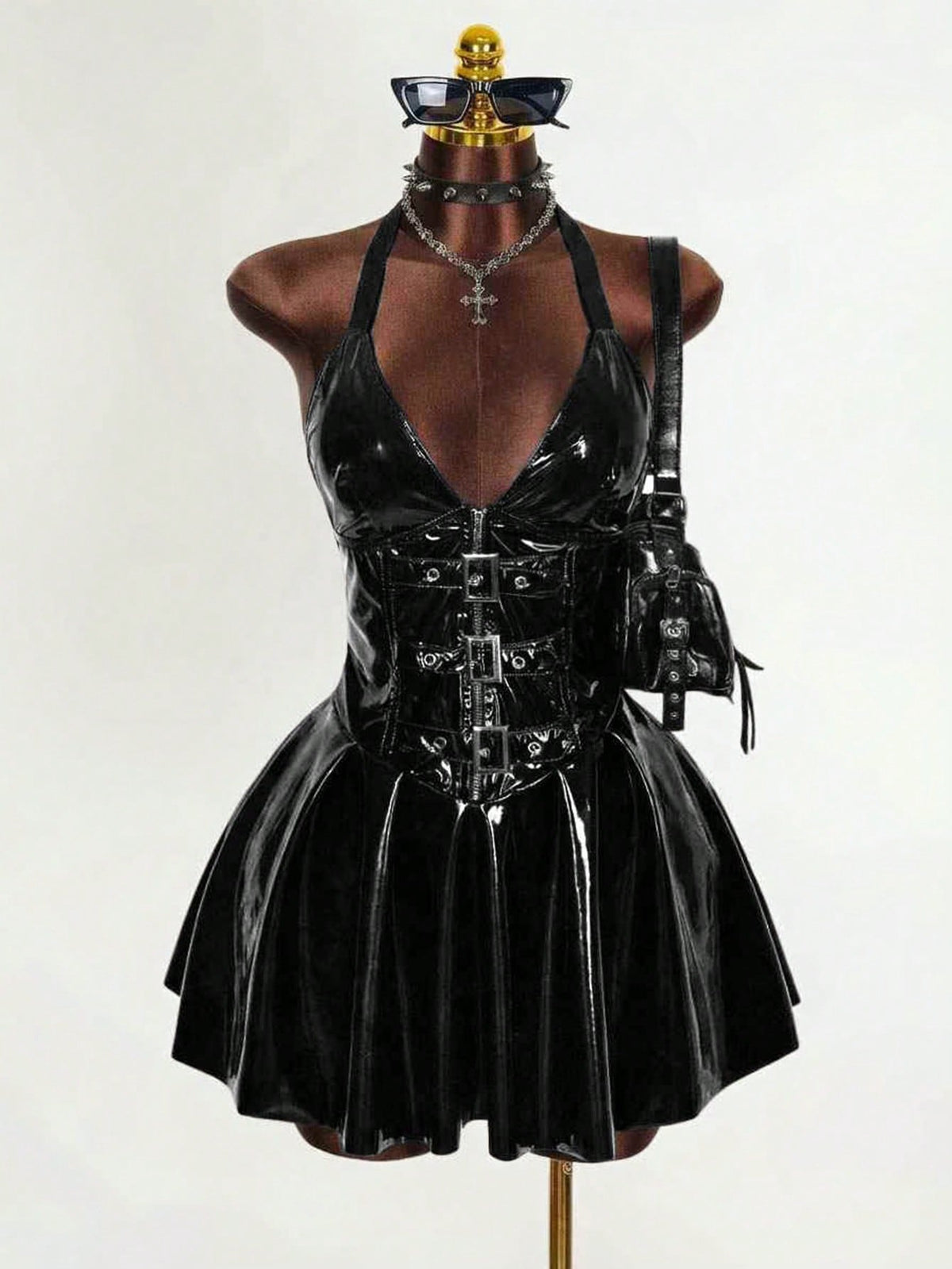 Women's black Goth PU leather mini dress featuring a backless halter neckline, cold shoulder detail, and flared hem.