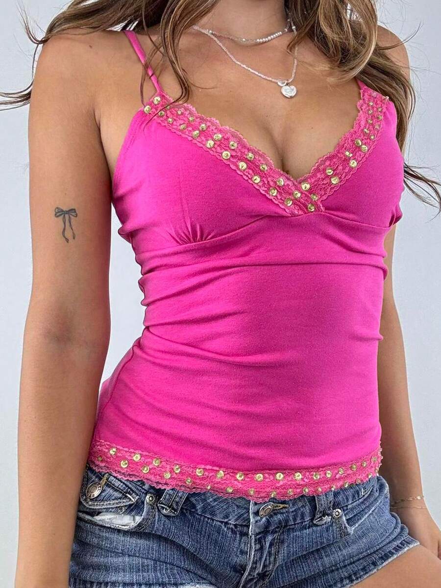 Women's deep V-neck camisole top featuring contrast hollow lace trim, cutout detail, and thin spaghetti straps.