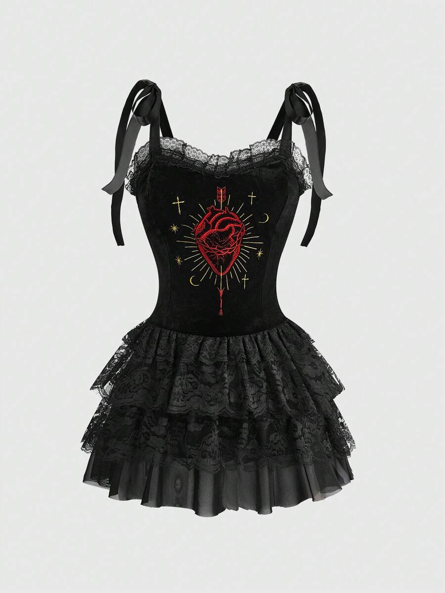 Women's black gothic cami mini dress featuring swan embroidery, contrast lace detailing, shoulder straps, and an asymmetrical hem.