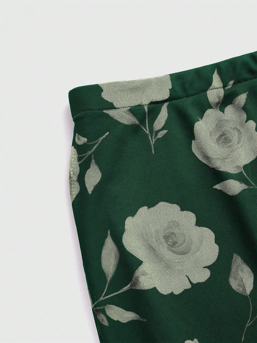 Women's Floral Pattern Mesh Skirt in black featuring a high waist, long mermaid cut, side split, and ruffle lettuce trim.