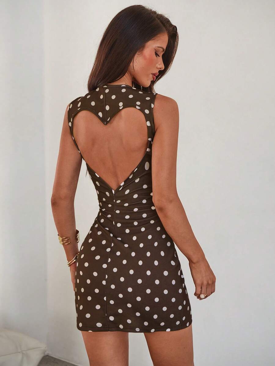 Light yellow backless mini bodycon cami dress for women featuring heart cutout detail and slim fit knitted fabric.