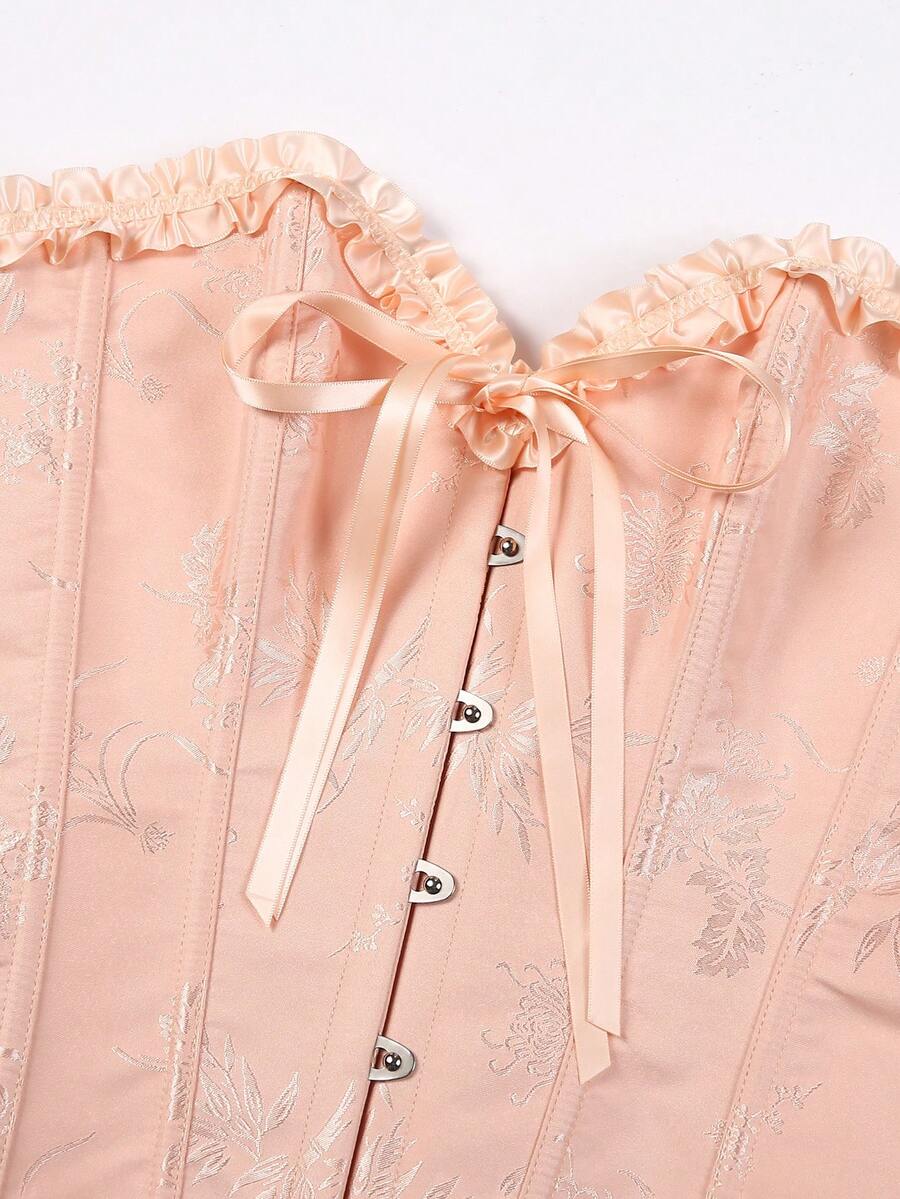 Women’s strapless corset bustier top with front button detail, lace-up back, frill accents, slim fit, and asymmetrical hem.