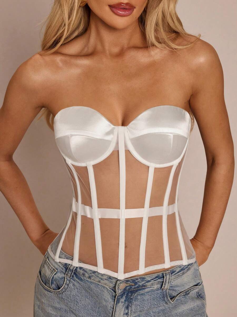 Women's black mesh patchwork bustier corset crop top with sweetheart neckline and asymmetrical hem.
