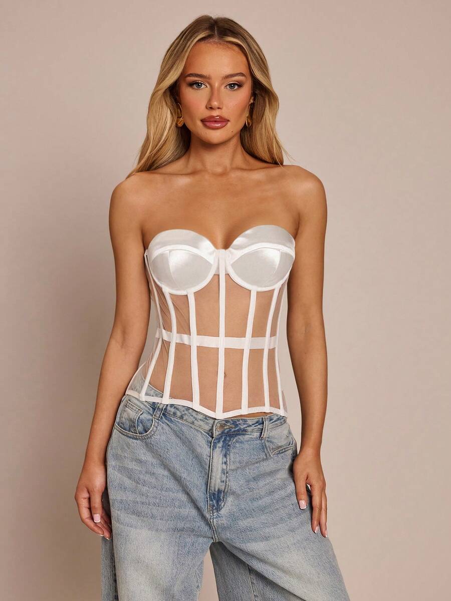 Women's black mesh patchwork bustier corset crop top with sweetheart neckline and asymmetrical hem.
