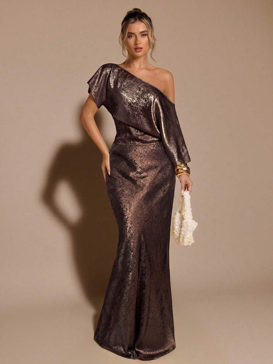 Black low waist extra long mermaid maxi skirt with asymmetrical zipper detail and side slit.