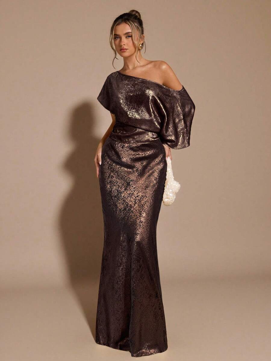 Black low waist extra long mermaid maxi skirt with asymmetrical zipper detail and side slit.