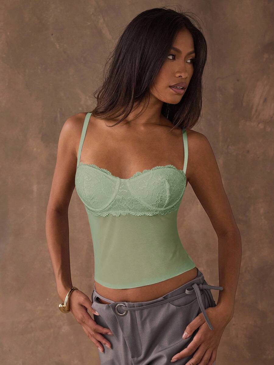Women's black contrast lace camisole with spaghetti straps, cup detail, semi-sheer finish, and slim fit for going out or date night.