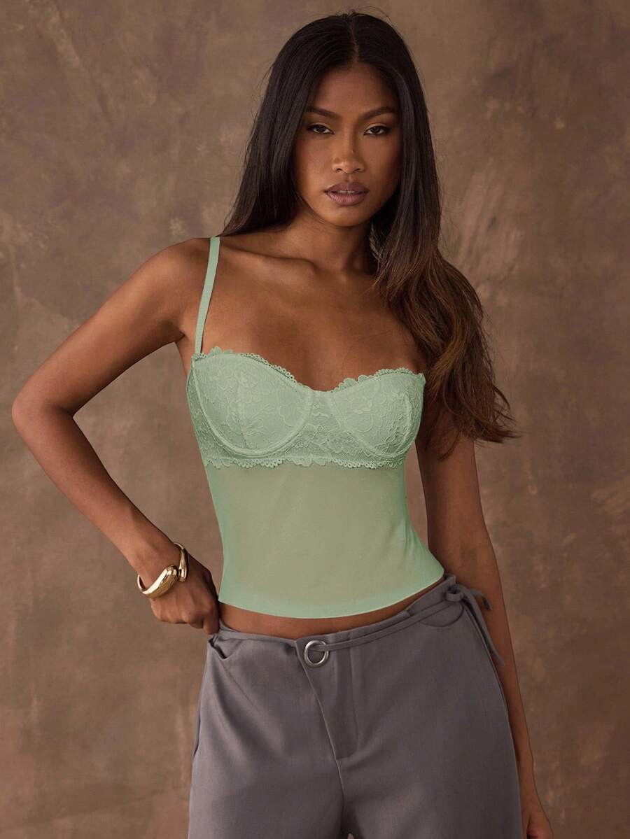 Women's black contrast lace camisole with spaghetti straps, cup detail, semi-sheer finish, and slim fit for going out or date night.