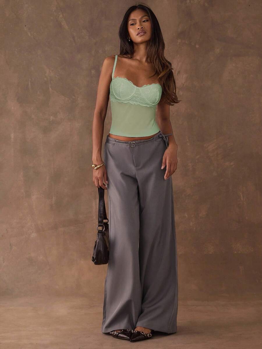 Women's black contrast lace camisole with spaghetti straps, cup detail, semi-sheer finish, and slim fit for going out or date night.