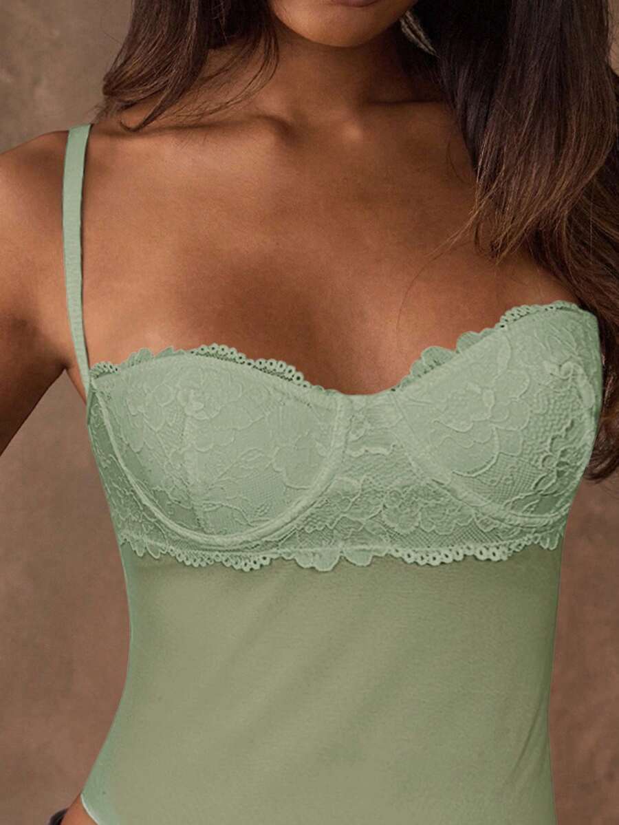 Women's black contrast lace camisole with spaghetti straps, cup detail, semi-sheer finish, and slim fit for going out or date night.