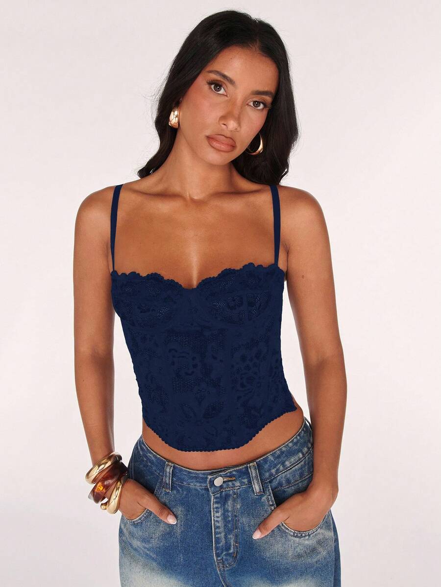 Black women’s lace cami top with spaghetti straps, contrast lace details, and an asymmetrical hem, styled as a slim-fit lined casual top.
