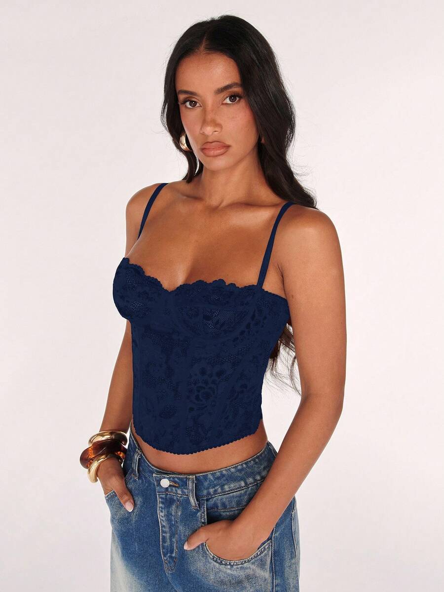 Women’s camisole top with cup detail, spaghetti straps, lined body, and slim fit design in knitted fabric with an asymmetrical hem.