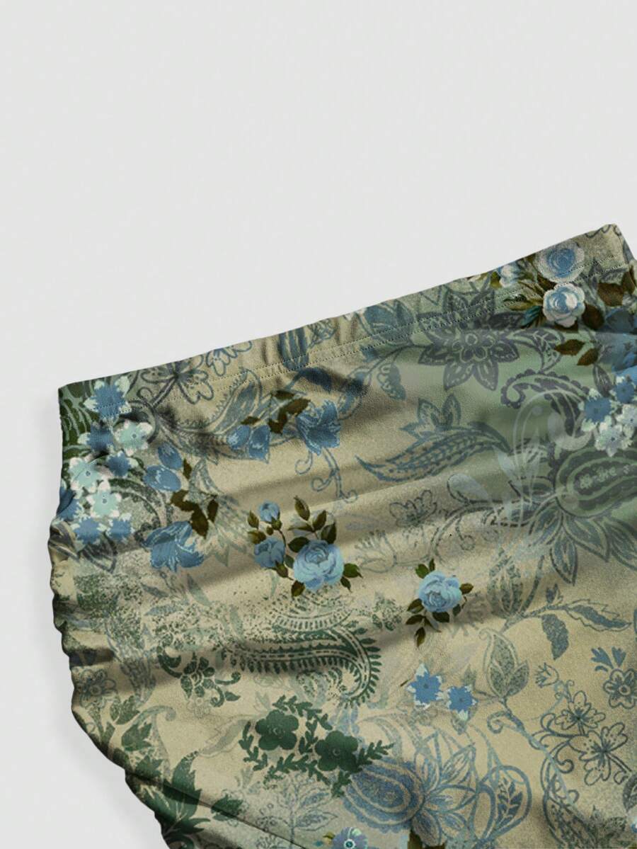 Black low waist ruched bodycon maxi skirt with sun and moon full print pattern on high stretch knitted fabric.