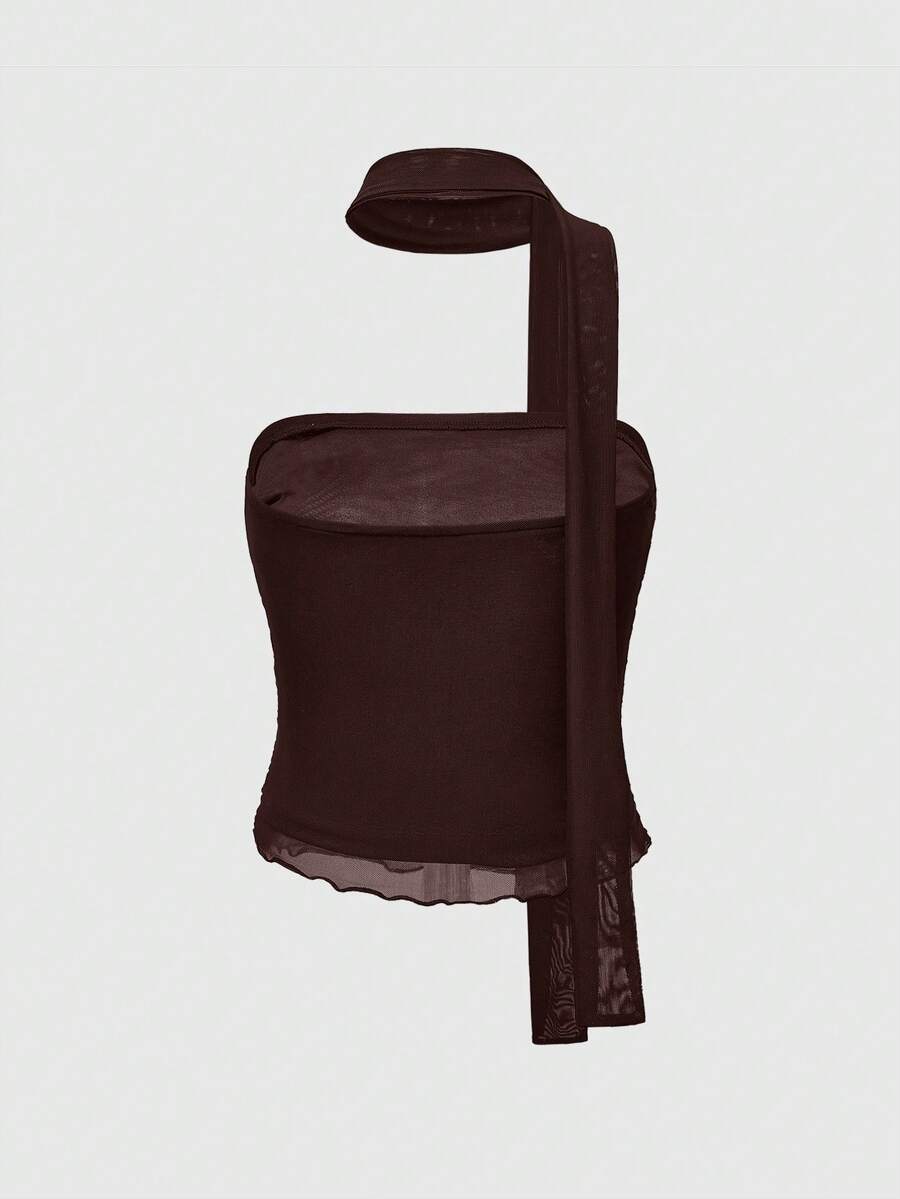 Women's black polka dot strapless tube top made of ruched mesh fabric featuring an asymmetrical hem and matching scarf.