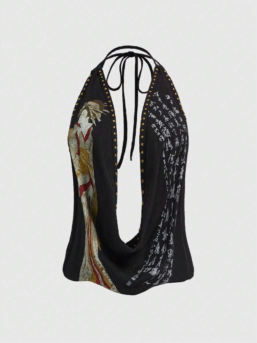 Women's black backless halter crop top featuring a V-neckline, tie-back detail, and asymmetrical hem.