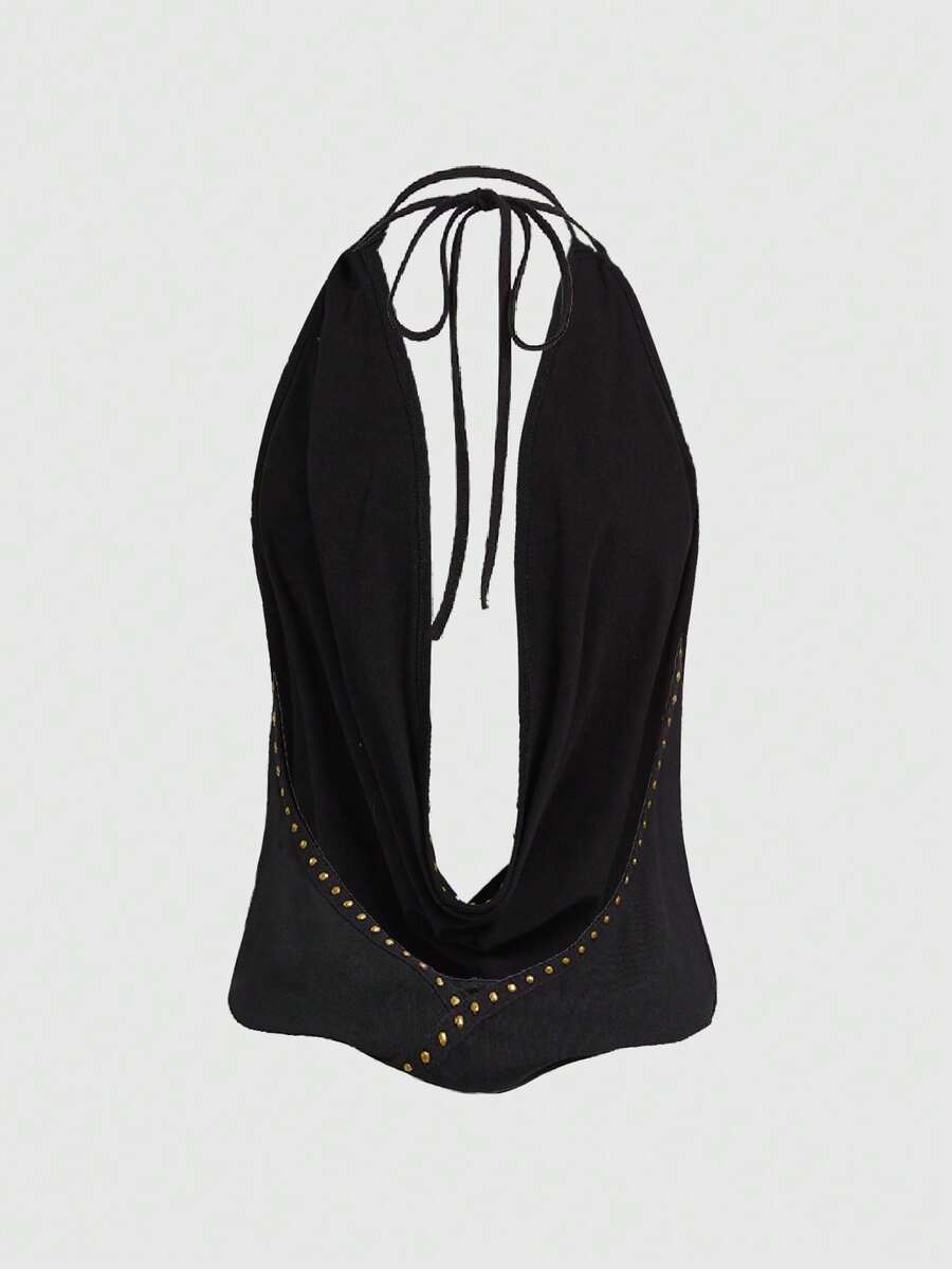 Women's black backless halter crop top featuring a V-neckline, tie-back detail, and asymmetrical hem.