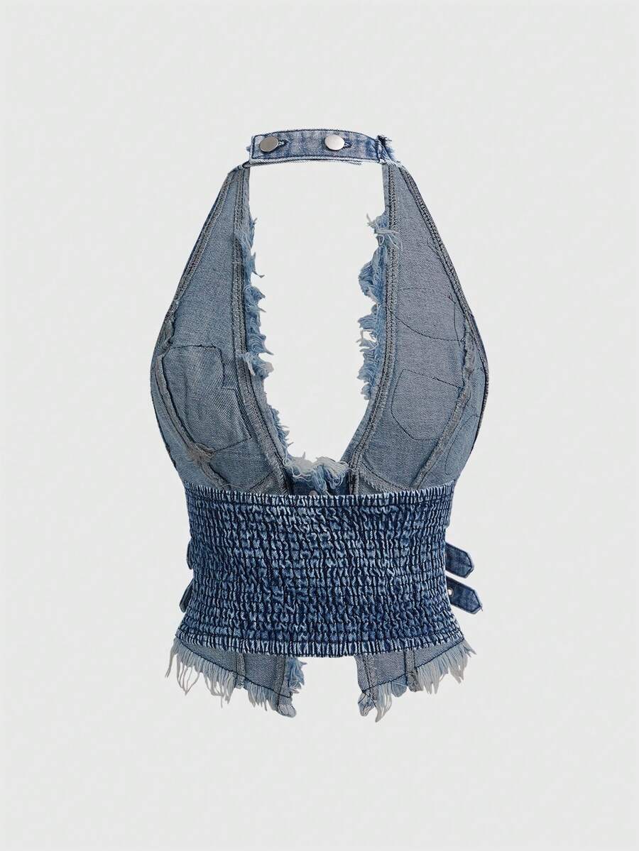 Women's denim halter crop top featuring a backless design, asymmetrical hem, single-breasted front, and lettuce trim.