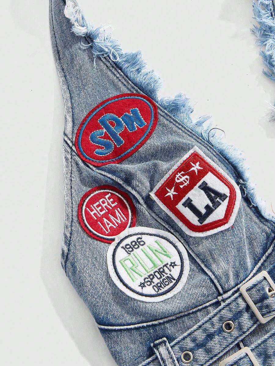 Women's denim halter crop top featuring a backless design, asymmetrical hem, single-breasted front, and lettuce trim.