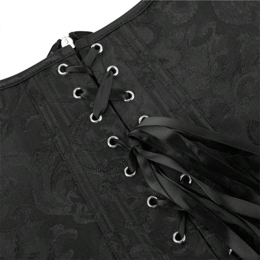 Vintage lace-up waist trainer corset with grommet eyelet details and plant pattern, designed for Halloween styling.