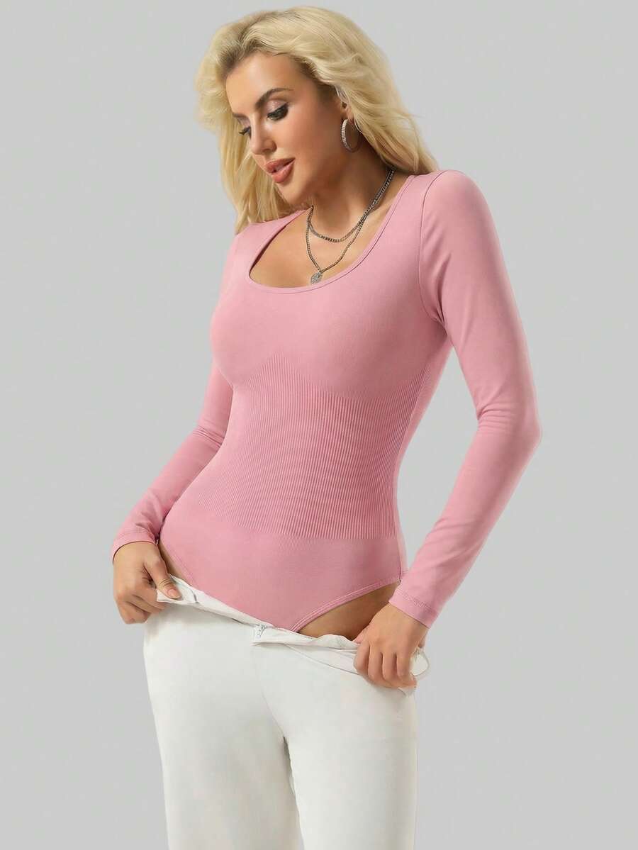 Black seamless long sleeve crew neck shapewear bodysuit for women featuring full coverage tummy control.