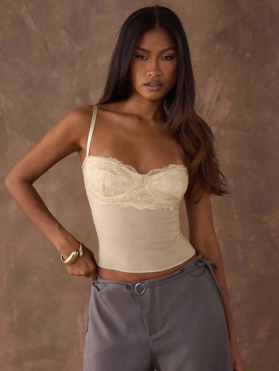 Women's black contrast lace camisole with spaghetti straps, cup detail, semi-sheer finish, and slim fit for going out or date night.