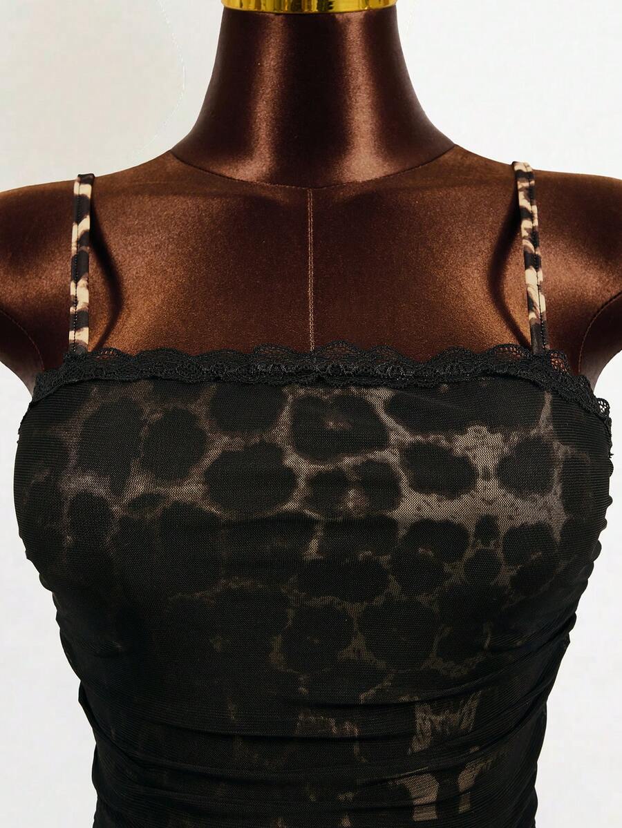 Black sleeveless mesh cami mini dress featuring spaghetti straps and slim fit design for women.