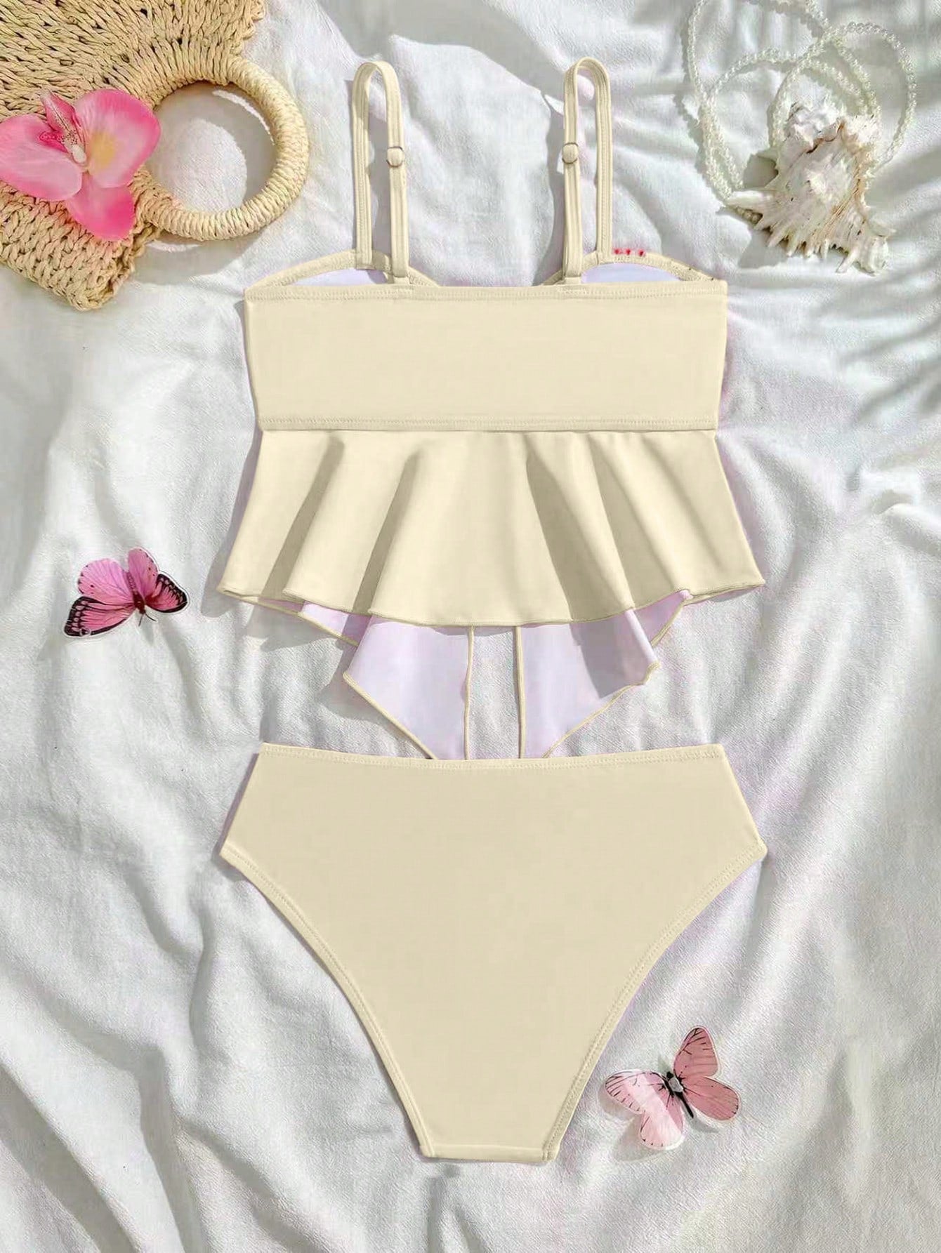 Tween girls two-piece tankini swimwear set with spaghetti straps, asymmetrical design, and 3D rose detail. Features a plant-pattern top and mid-waist bottoms in stretchy fabric for beach or pool wear.
