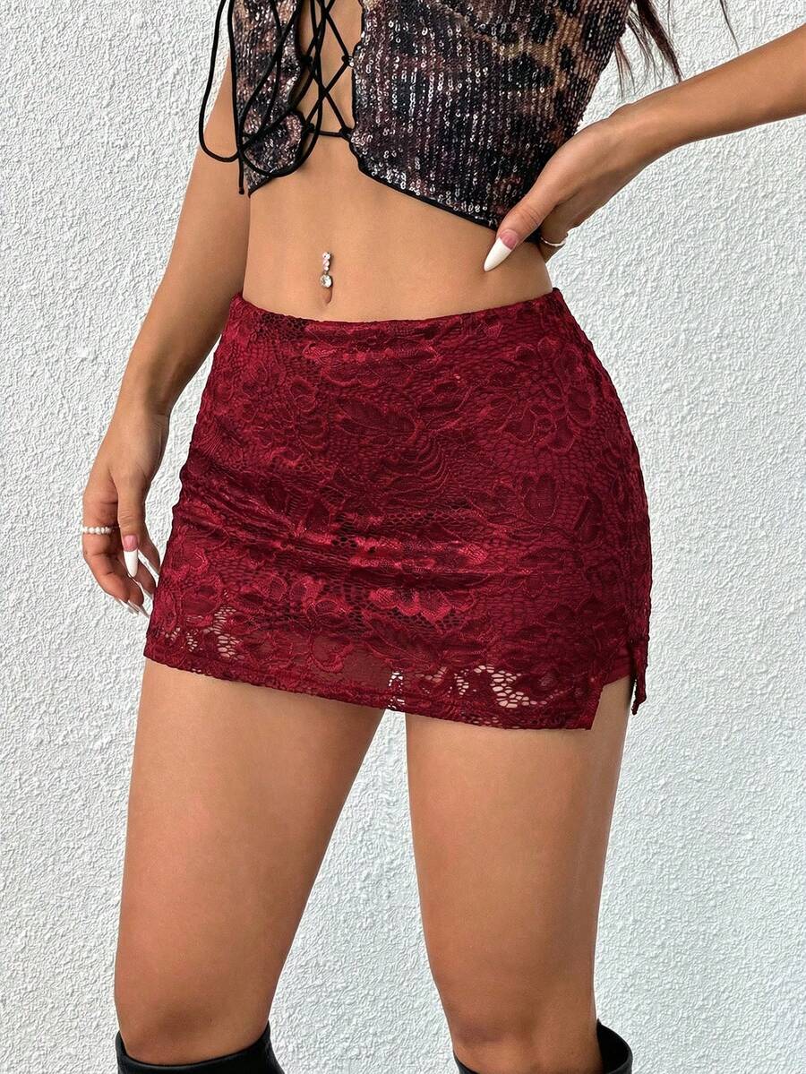 Women's black low waist bodycon mini skirt featuring contrast lace trim, side split detail, and zipper closure.