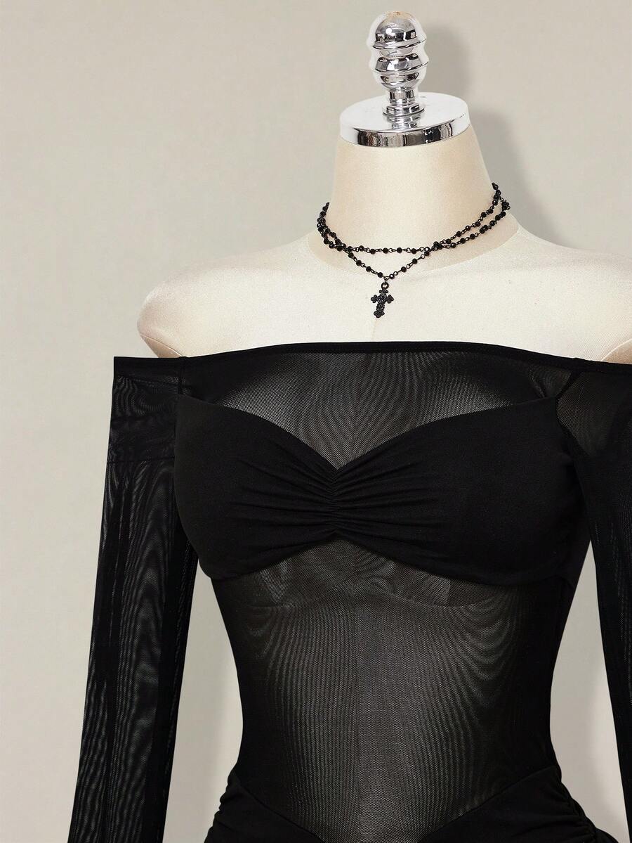 Women's black off-shoulder mini dress featuring sheer mesh patchwork details, ruched bodycon fit, and long flare sleeves.