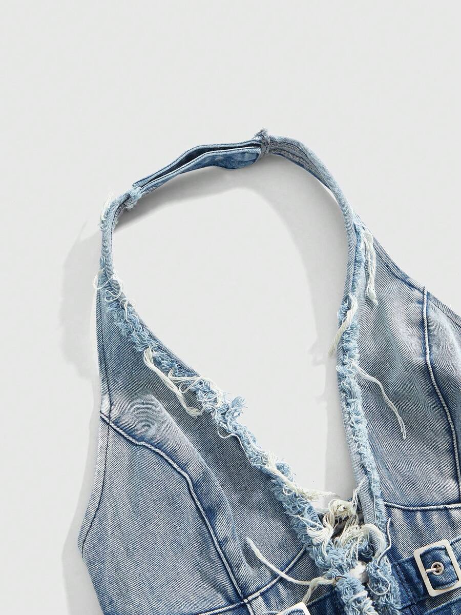 Women's denim halter crop top featuring a backless design, asymmetrical hem, single-breasted front, and lettuce trim.