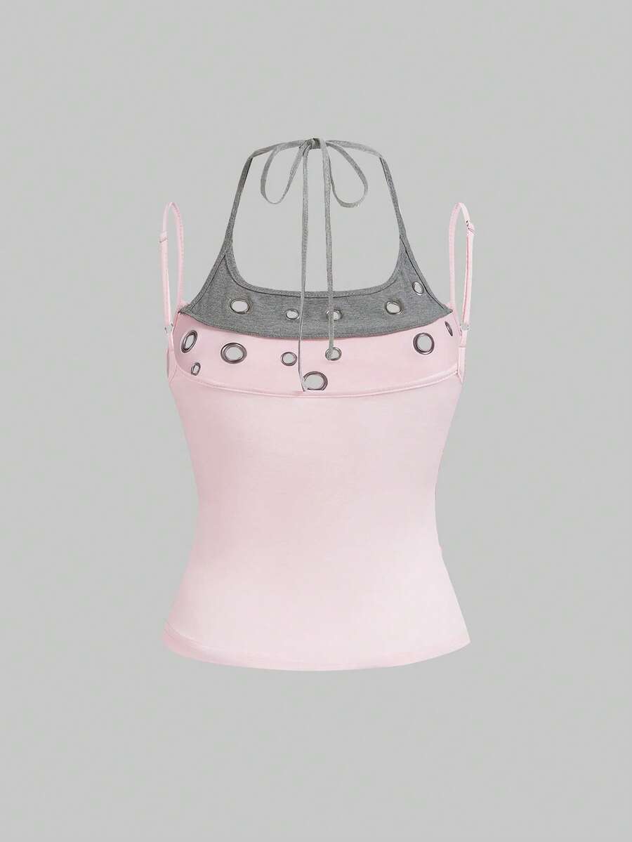 Black halter crop tank top for women featuring lace up front details, ruched accents, and appliques in a slim fit knitted fabric.