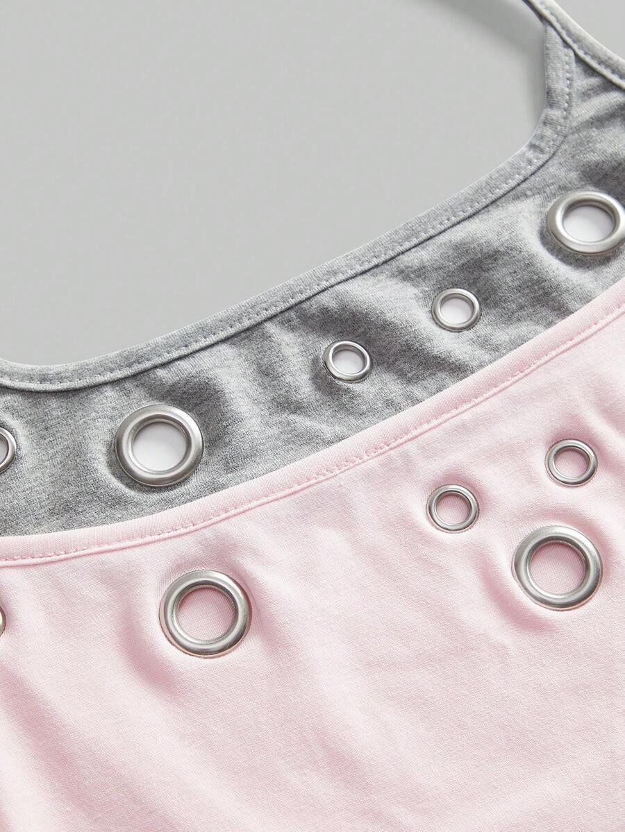 Black halter crop tank top for women featuring lace up front details, ruched accents, and appliques in a slim fit knitted fabric.