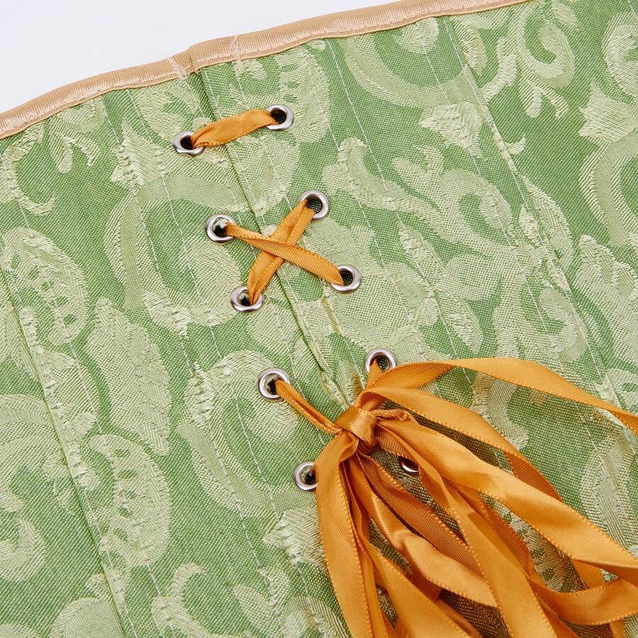 Vintage lace-up waist trainer corset with grommet eyelet details and plant pattern, designed for Halloween styling.