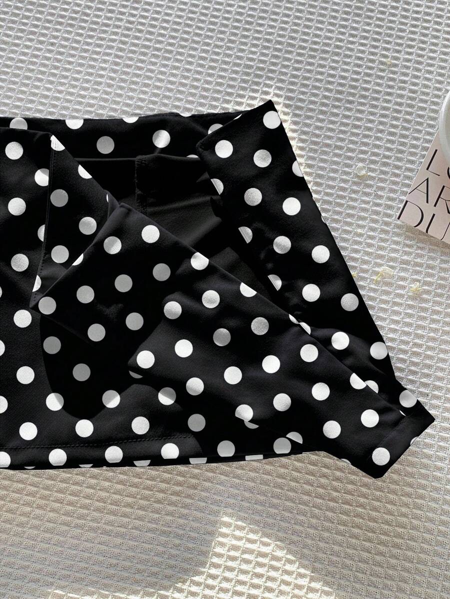 Women's white 100% cotton low waist mini skirt featuring a tropical print and zipper detail.